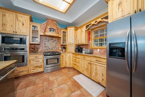 Everything you need is right here to prepare anything from light snacks to a holiday feast. Two ovens + microwave, stove, fridge and dishwasher. We're fully stocked with cookware, utensils, and a stylish mountain-themed plate set.