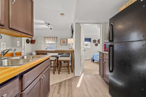 Cozy kitchen with breakfast bar, wood counters & open layout