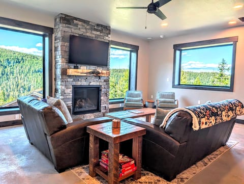 Family room, Views, Gas fireplace, Leather couches, 55" smart TV, Ceiling fan, Yoga mats