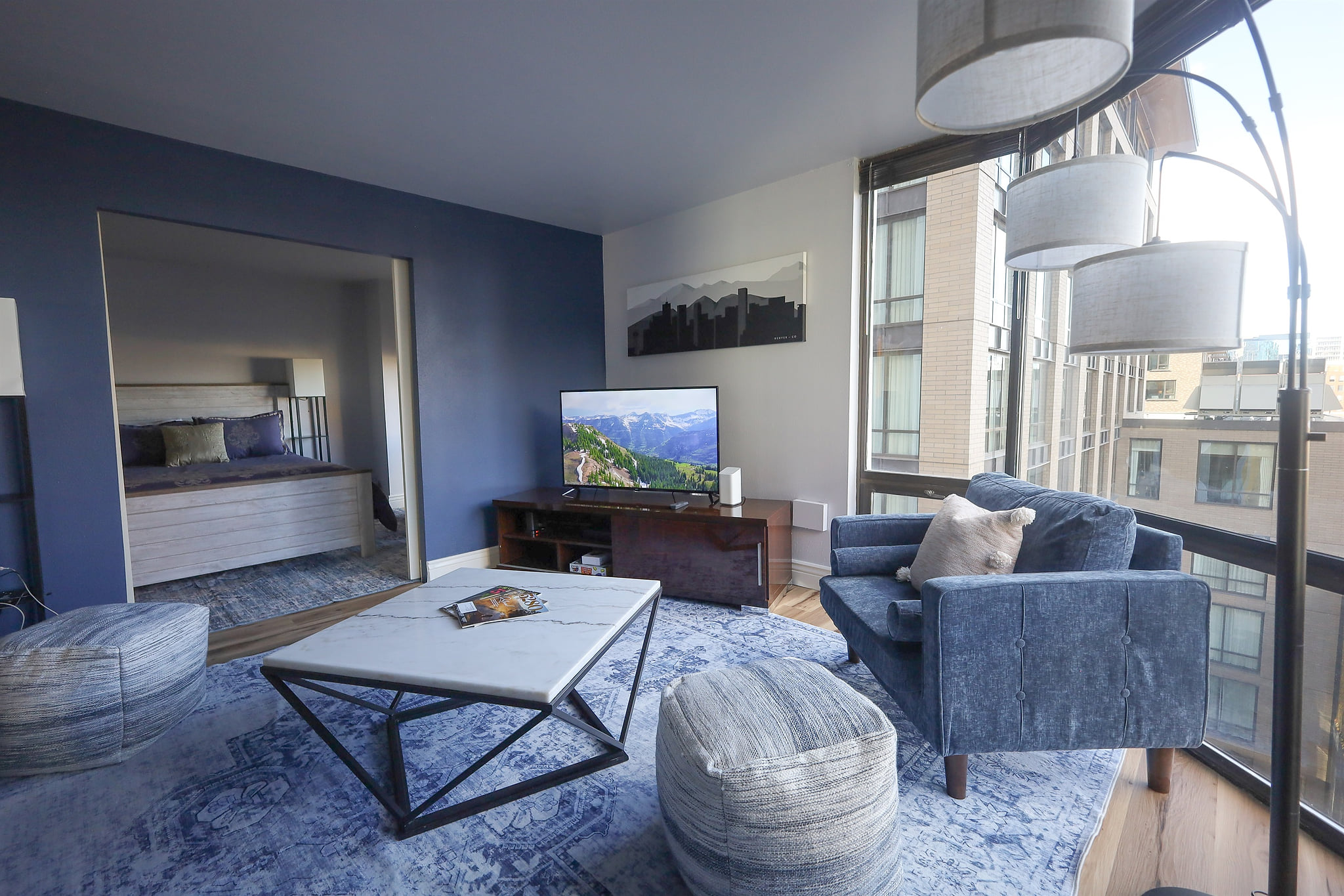 Main living room with views from the 8th floor- the Coors Baseball Field is in view.