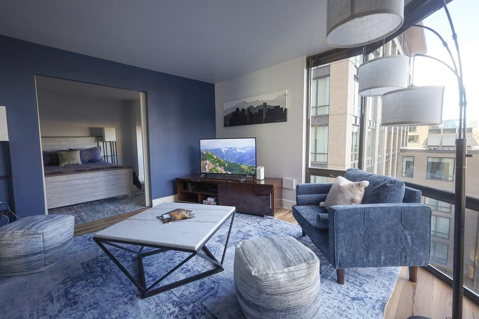 Main living room with views from the 8th floor- the Coors Baseball Field is in view.