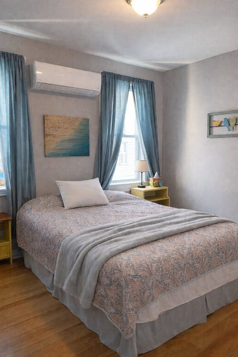 Second bedroom with cozy queen bed and dedicated mini split air conditioning.