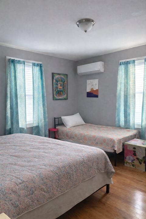 Third bedroom with queen bedding and a twin for extra sleeping arrangements. Dedicated mini split for comfortable temperature controlled nights.