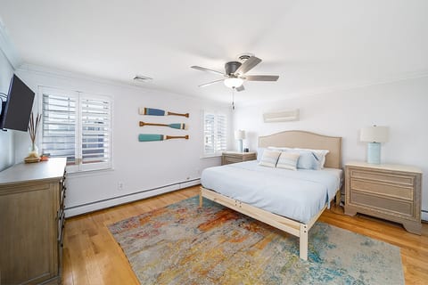 Spacious king sized bed in the primary bedroom with an abundance of storage space.