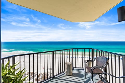 Private balcony with breathtaking Gulf views, perfect for relaxing while overlooking the white-sand beach and emerald water