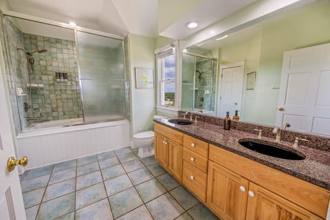 Spa-inspired primary bathroom — premium fixtures, elegant tilework, and luxurious appointments for a refined bathing experience