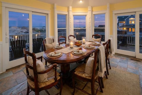 Grand formal dining for 20+ guests — floor-to-ceiling ocean views create an extraordinary setting for celebratory meals and intimate gatherings