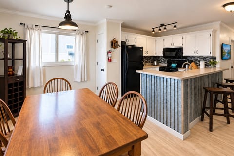 This kitchen is fully equipped with stove/oven, microwave, refrigerator, dishwasher, regular coffee maker, single cup coffee maker, toaster, blender, crock pot, pots and pans