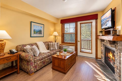 Living area with a smart TV and fireplace, perfect for relaxation!