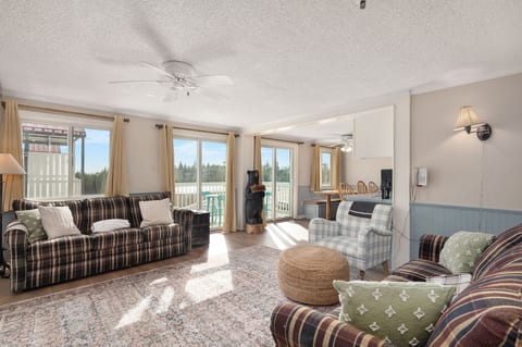 Cozy up by the fire in this spacious living room with stunning views!