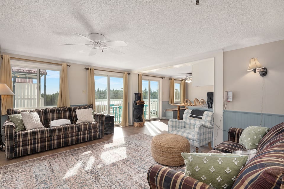 Cozy up by the fire in this spacious living room with stunning views!