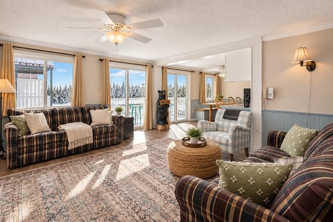 Cozy up by the fire in this spacious living room with stunning views!