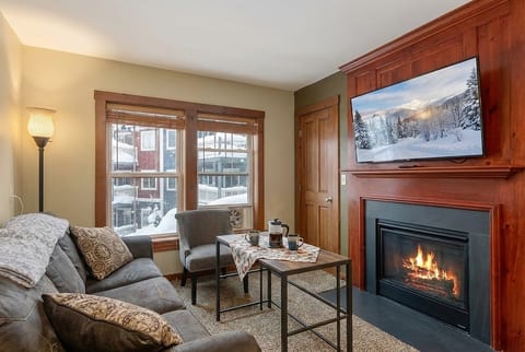 Cozy up by the fireplace in this inviting living room. Here's what other guests have to say: Colleen McGovern: "The condo was spotless and matched the description and photos perfectly. I wou