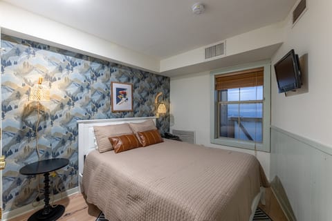 Sweet dreams await in this cozy bedroom! Guest Review from Heather Johnson: "The mattresses were so comfortable, and there were plenty of towels and pillows. The remodeled bathrooms were a highlight, with fantastic water pressure and hot showers."