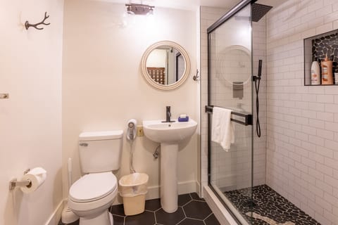 Relax and unwind in this modern bathroom with a spacious shower!