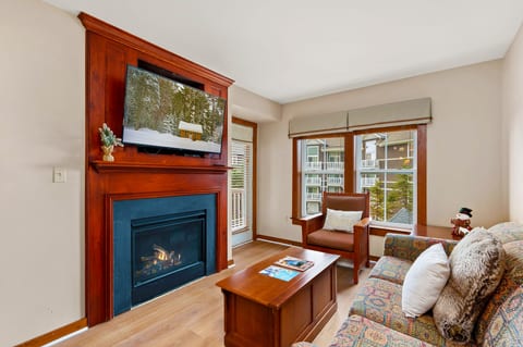 The fireplace and TV provide a cozy atmosphere for movie nights.