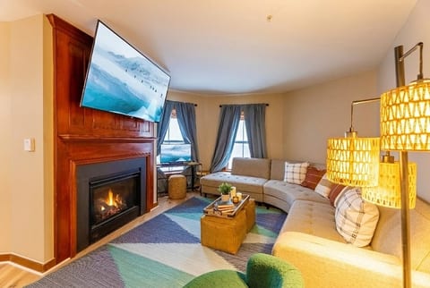 This living room features a comfortable seating area and a smart TV.