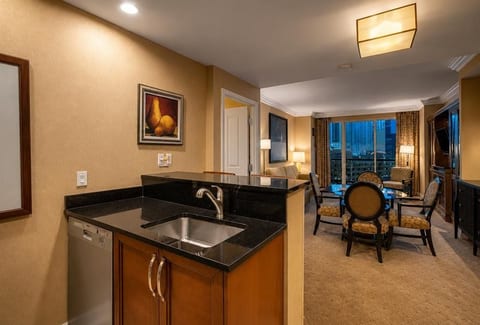 Kitchen with Living Room View | Open Plan | Granite Counters | Sink & Full Appliances | Skip Expensive Room Service | Cook & Save | MGM Signature 1BR Condo Las Vegas Strip