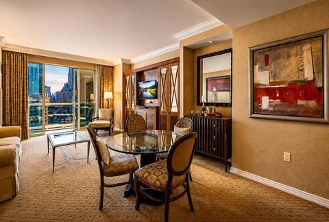 Spacious Living & Dining Area | Floor-to-Ceiling Strip Views | Queen Sleeper Sofa | Smart TV | Seats 4 | Open-Plan Layout | MGM Signature 1BR Suite | Las Vegas Vacation Rental