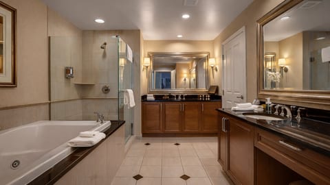 A luxurious ensuite with a soaking tub and elegant finishes. 🛁✨