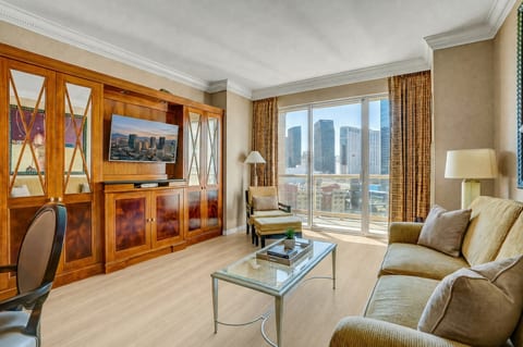 Strip-Adjacent Suite — Separate Living Area with Smart TV, Floor-to-Ceiling Strip Views