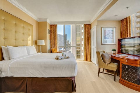 King Suite — 11th Floor Master Bedroom, Plush King Bed, Dedicated Workspace and Strip Views