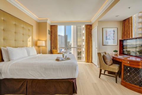 King Suite — 11th Floor Master Bedroom, Plush King Bed, Dedicated Workspace and Strip Views