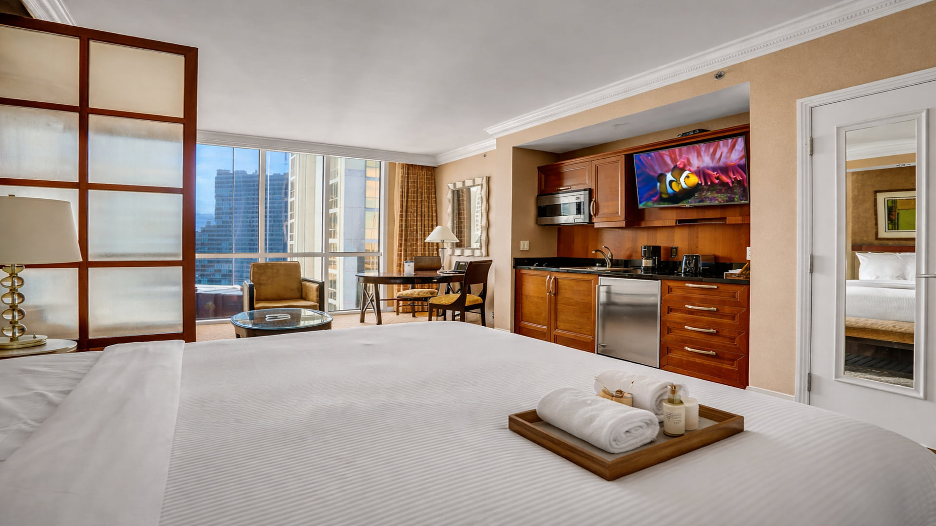 Relax & Recharge – Cozy king bed, smart TV, and a modern kitchenette for ultimate comfort.