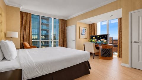 King Suite — Studio residence king bed with floor-to-ceiling windows and high-floor Las Vegas skyline views