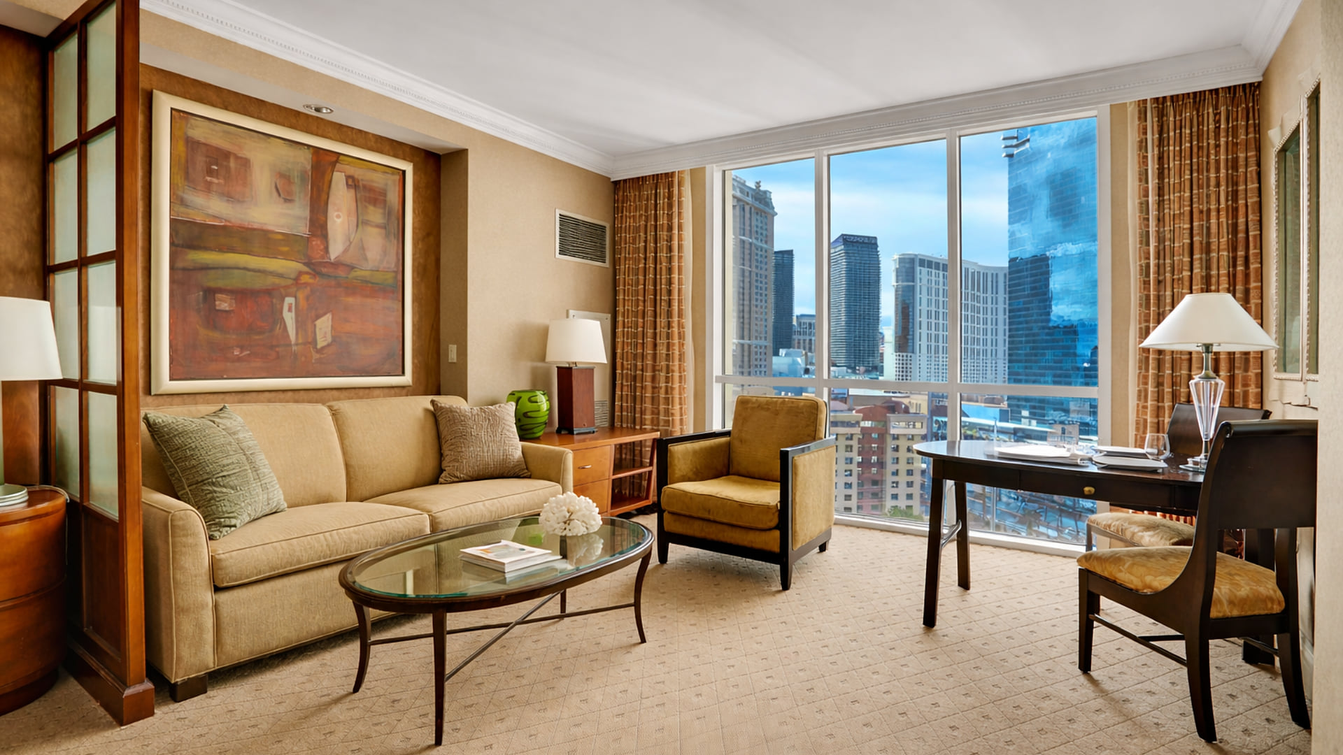 Unwind in the stylish living area with floor-to-ceiling windows showcasing the city.