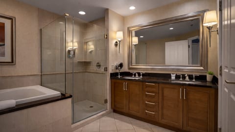 Relax and unwind in a spa-like bathroom with a soaking tub and a spacious glass shower!