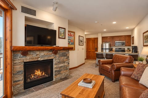 Cozy up by the fireplace and watch your favorite show.