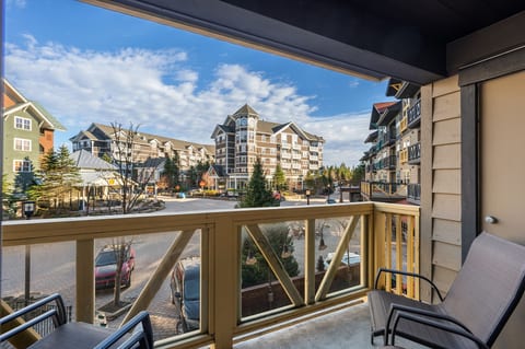 Sip your morning coffee or unwind with a glass of wine on the private balcony, with stunning views of the village.