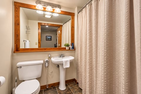 Warm Rustic Bathroom with Wood Accents. Get ready for the day in this fully appointed bathroom!