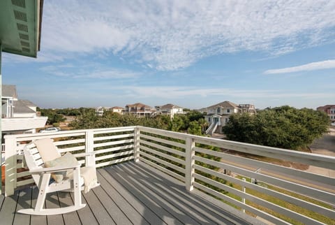 Relax on the private balcony with stunning Outer Banks views.