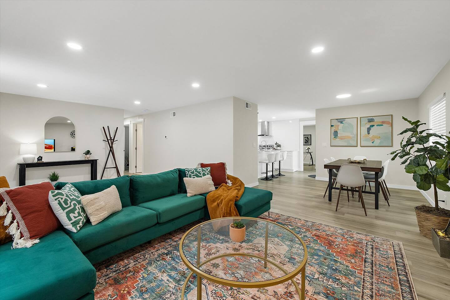 The living room is a  large space in  which to gather and it’s also close to the dining room and the kitchen so you have easy access to snacks.