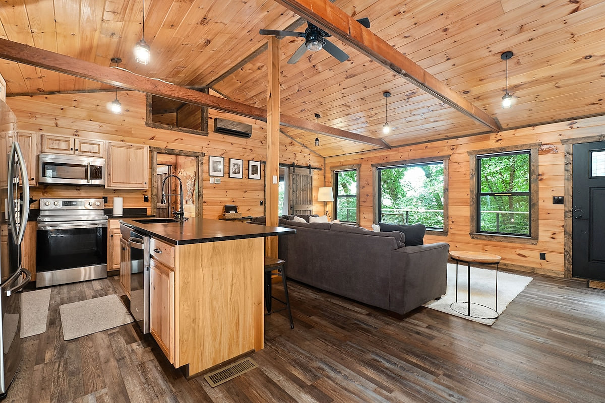 Modern kitchen with dishwasher and living area for conversations even while making meals.