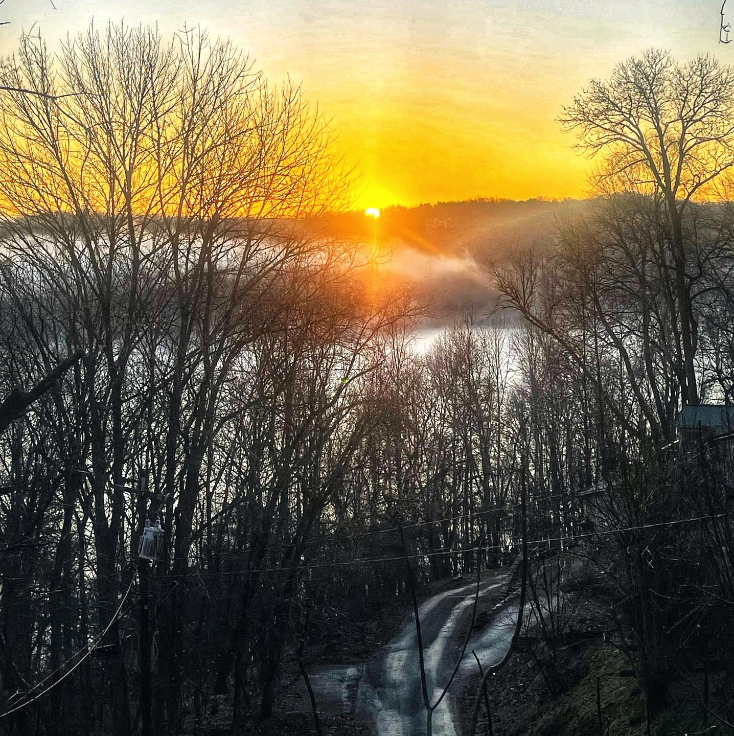 Sunrise with morning mist above the lake. All from the deck!