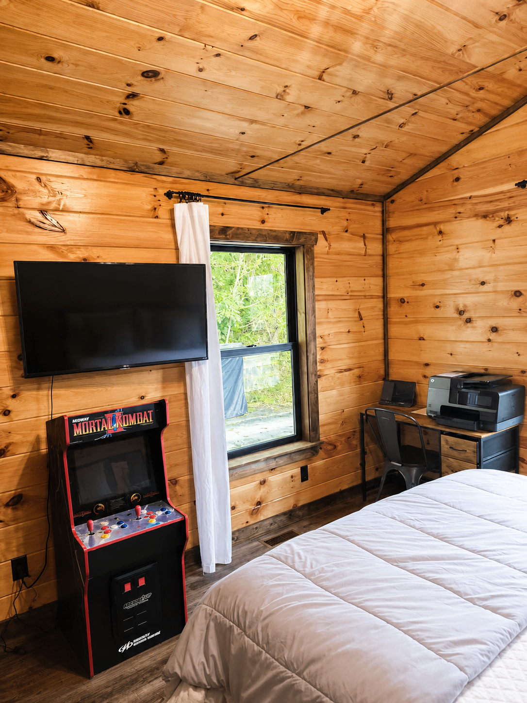 Bedroom 2 work area and arcade games