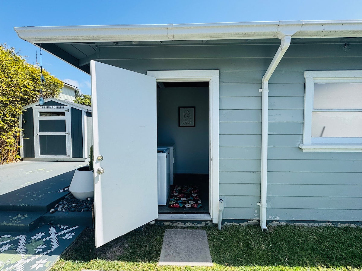 The detached laundry room has a washer and dryer. 