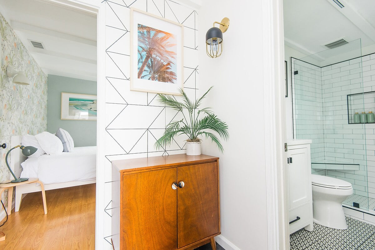 The back bedroom features one king bed and two large windows that overlook the hot tub. Right outside the bedroom door is bathroom #2 with a walk in shower. 