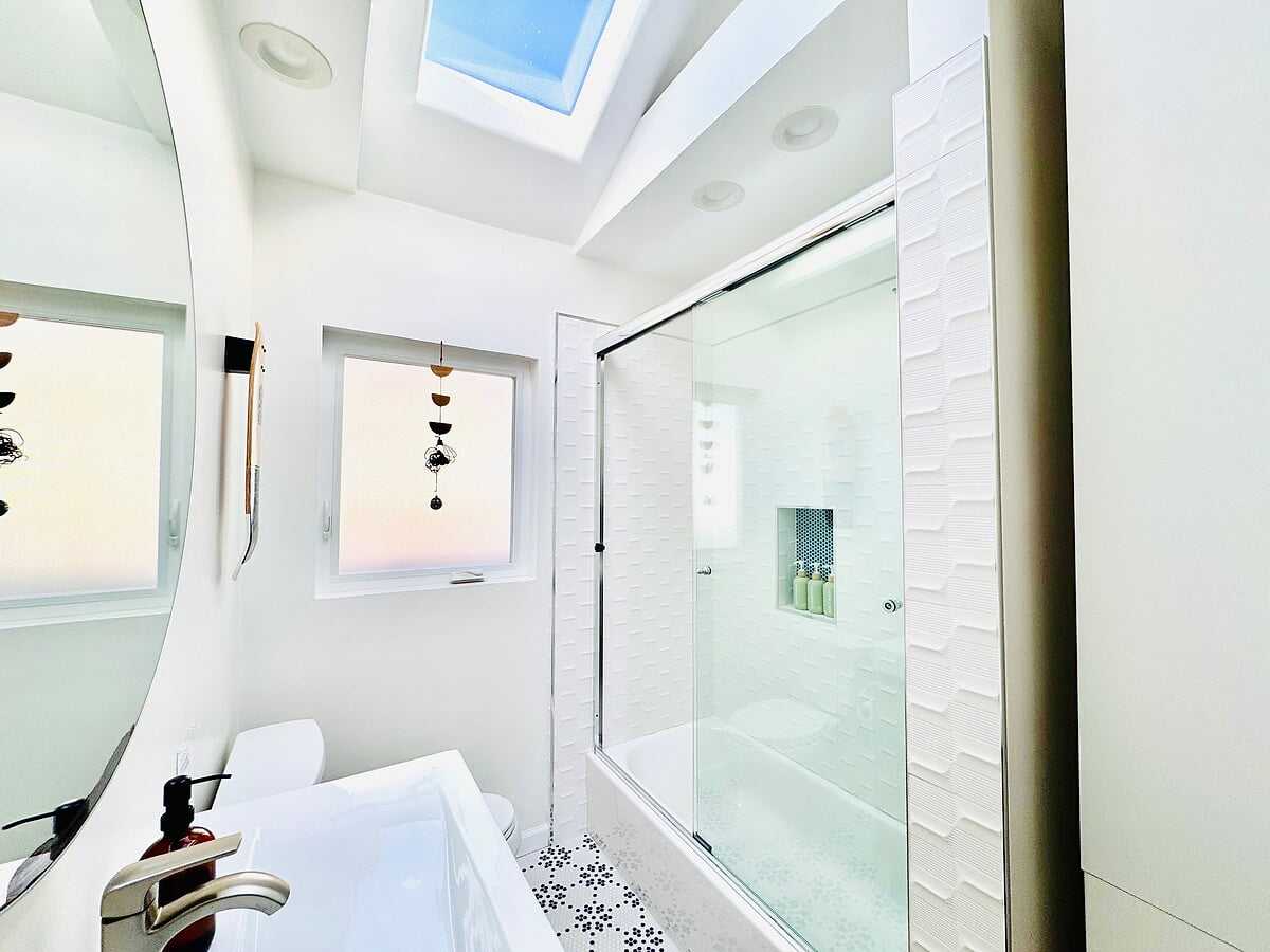 A bath tub in bathroom 1 is perfect for little kids. 