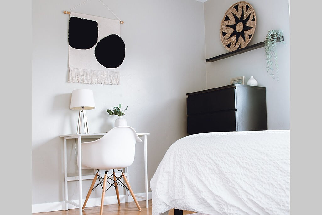 This spacious bedroom in our family-friendly home offers ample storage with built-in closets, a comfy bed, and a handy desk.  In the closet of this room you'll find a small ironing board and a pack-n-play with sheets. 