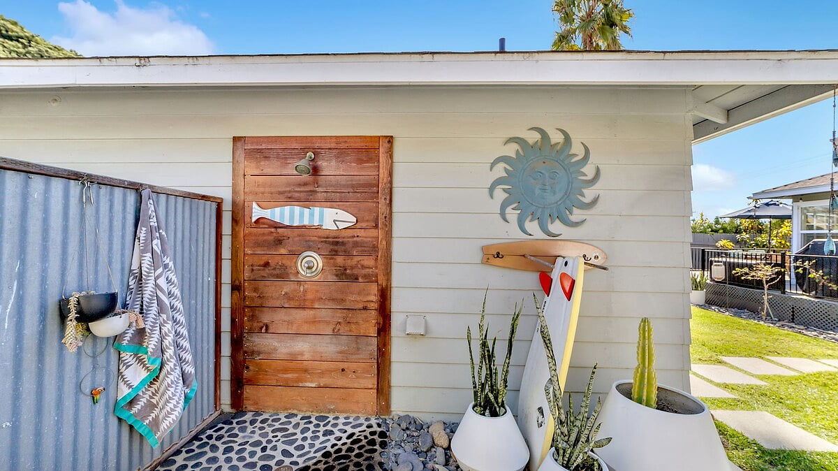 Warm outdoor shower to rinse all that beach sand from the kiddos 