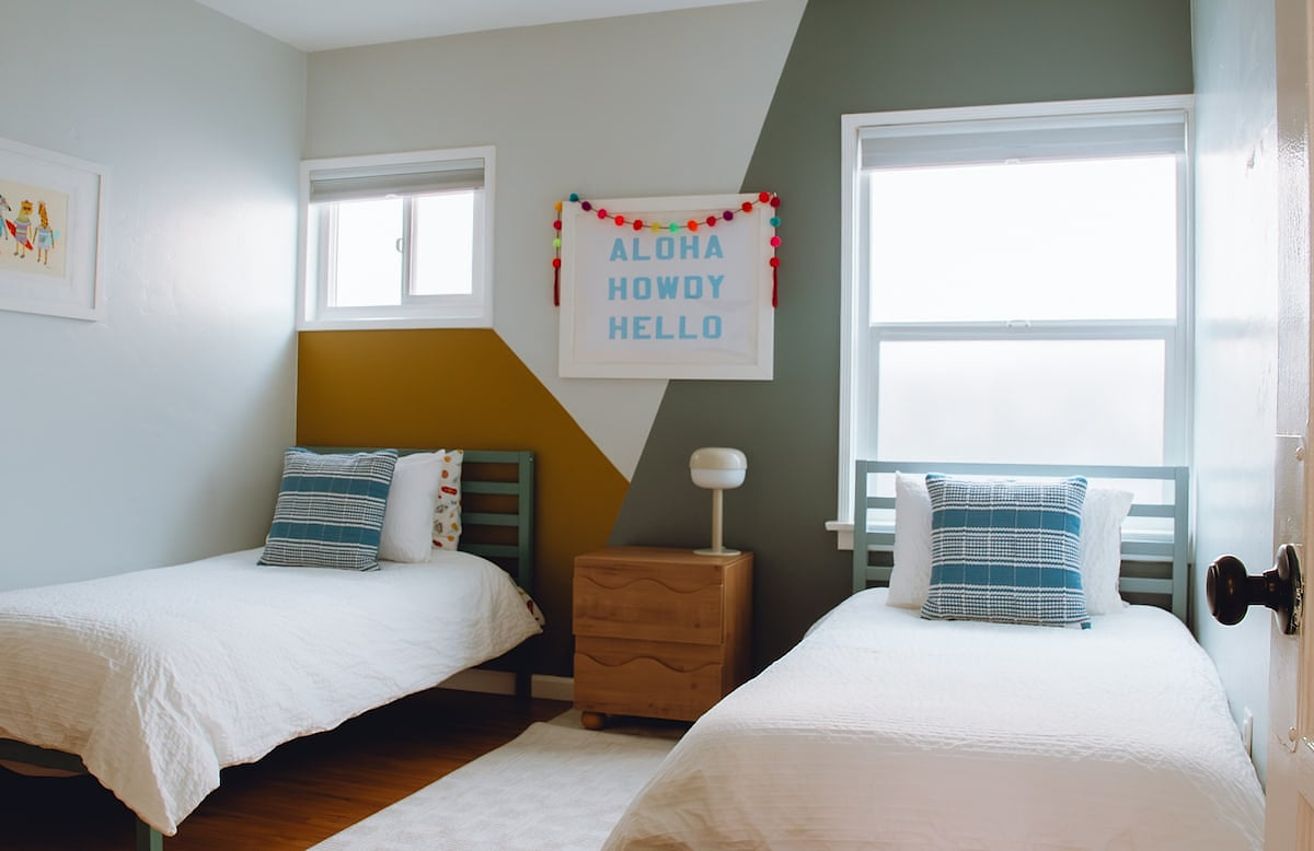 The kids' bedroom features two twin beds as well as tons of books and games. 