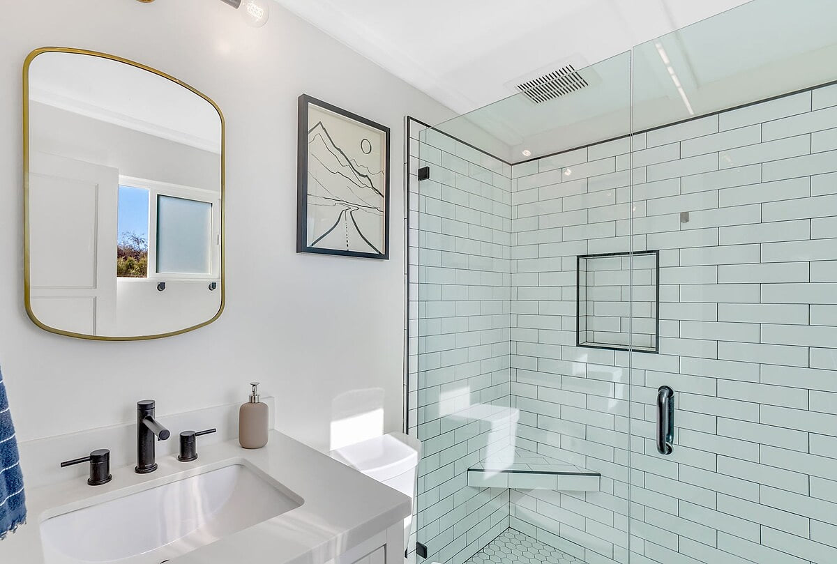 Bathroom 2 offers a tiled walk in shower. 