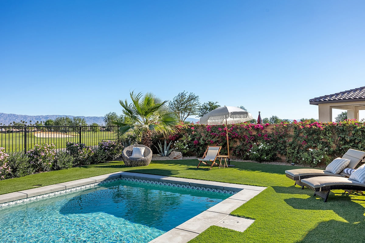 Salt water pool, golf course & mountain views. Please note - as of Nov 2023, this fence will be lowered to enhance the view! (There will still be a short fence for safety/security reasons). 