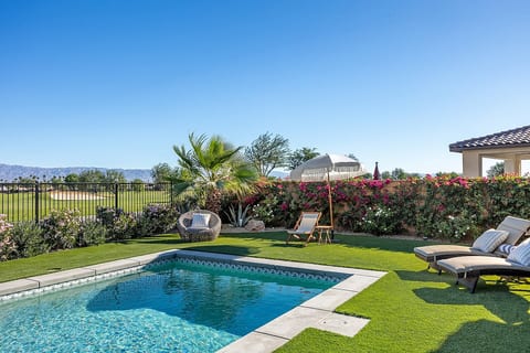 Salt water pool, golf course & mountain views. Please note - as of Nov 2023, this fence will be lowered to enhance the view! (There will still be a short fence for safety/security reasons).