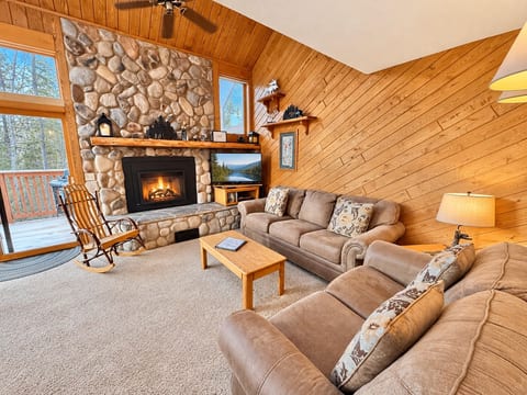 Living room with queen sleeper sofa and gas fireplace