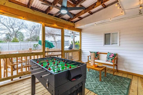 Challenge your friends to a game of foosball in our sunlit sunroom/game room—fun awaits!